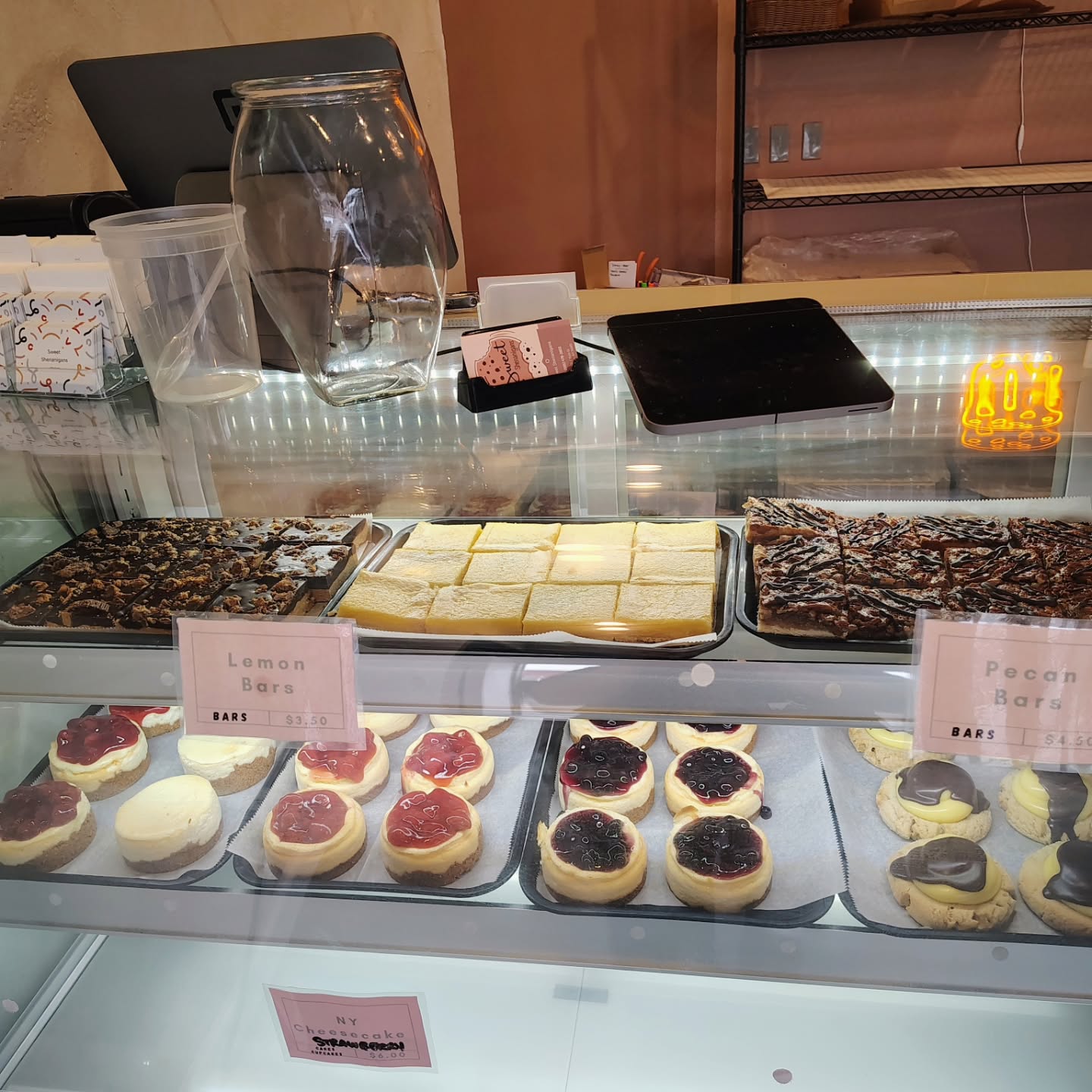 Bars and mini cheesecakes in the case