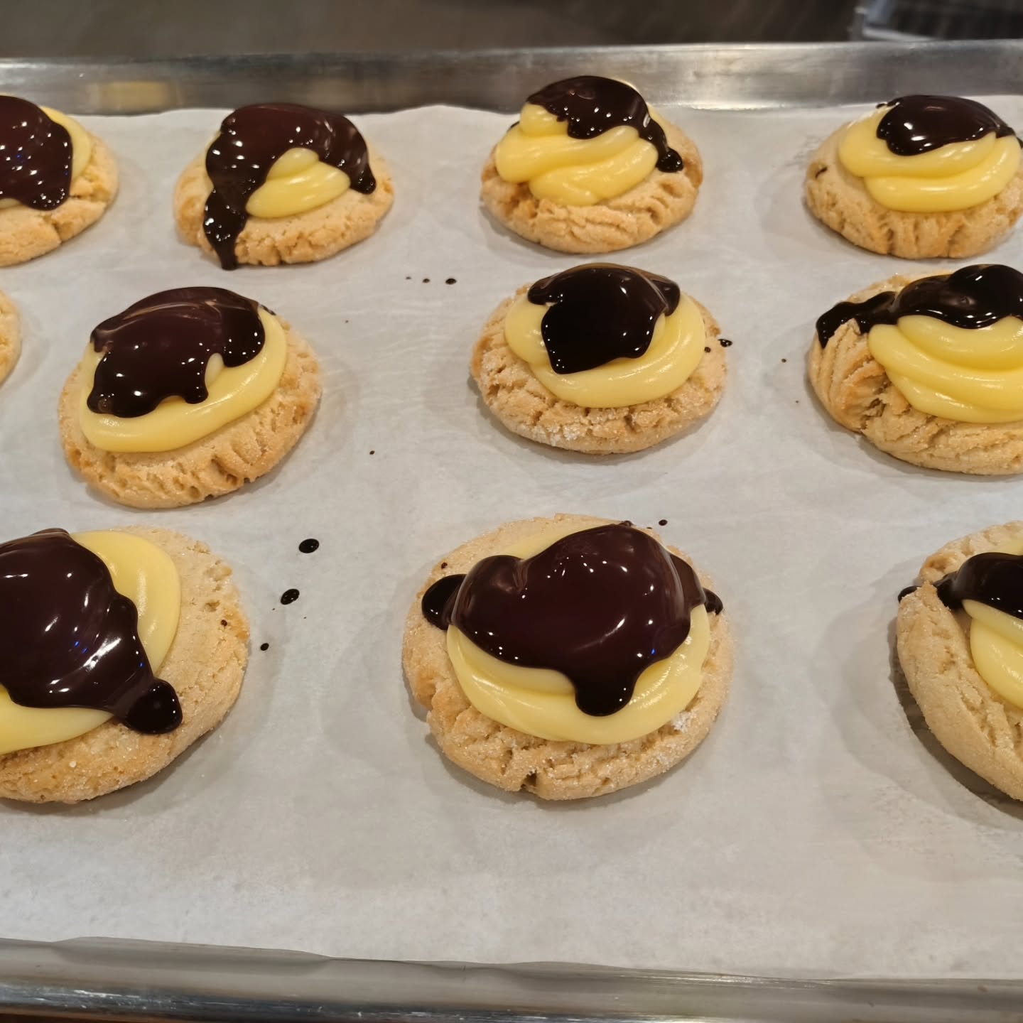 Boston cream cookies topped with custard and chocolate