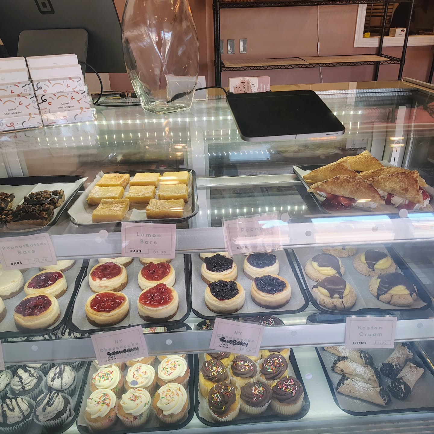 Cupcakes and cheesecakes in the display case