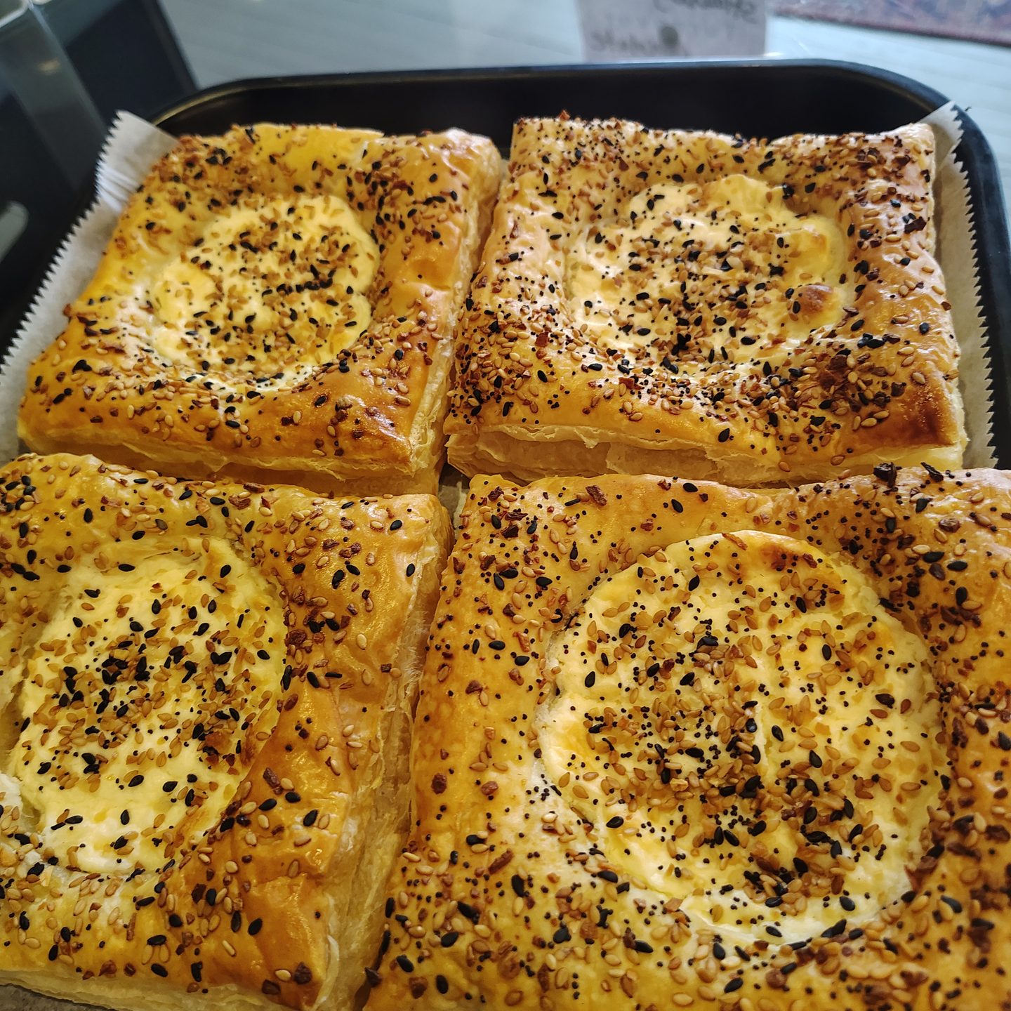 Everything danishes — squares of pastry filled with cream cheese and topped with everything seasoning