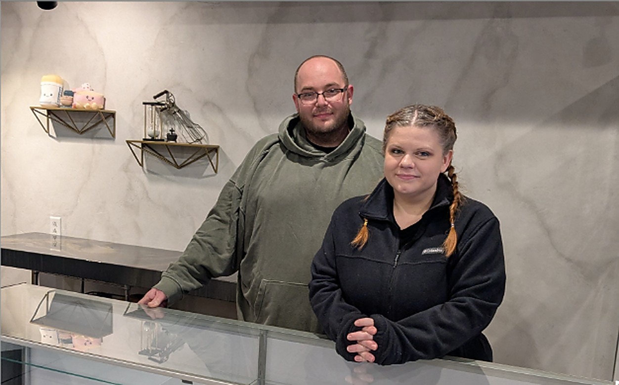 Kyle and Brittany, the owners of Sweet Shenanigans, behind the counter