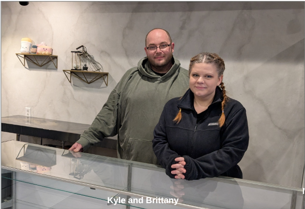 Kyle and Brittany, the owners of Sweet Shenanigans, behind the counter