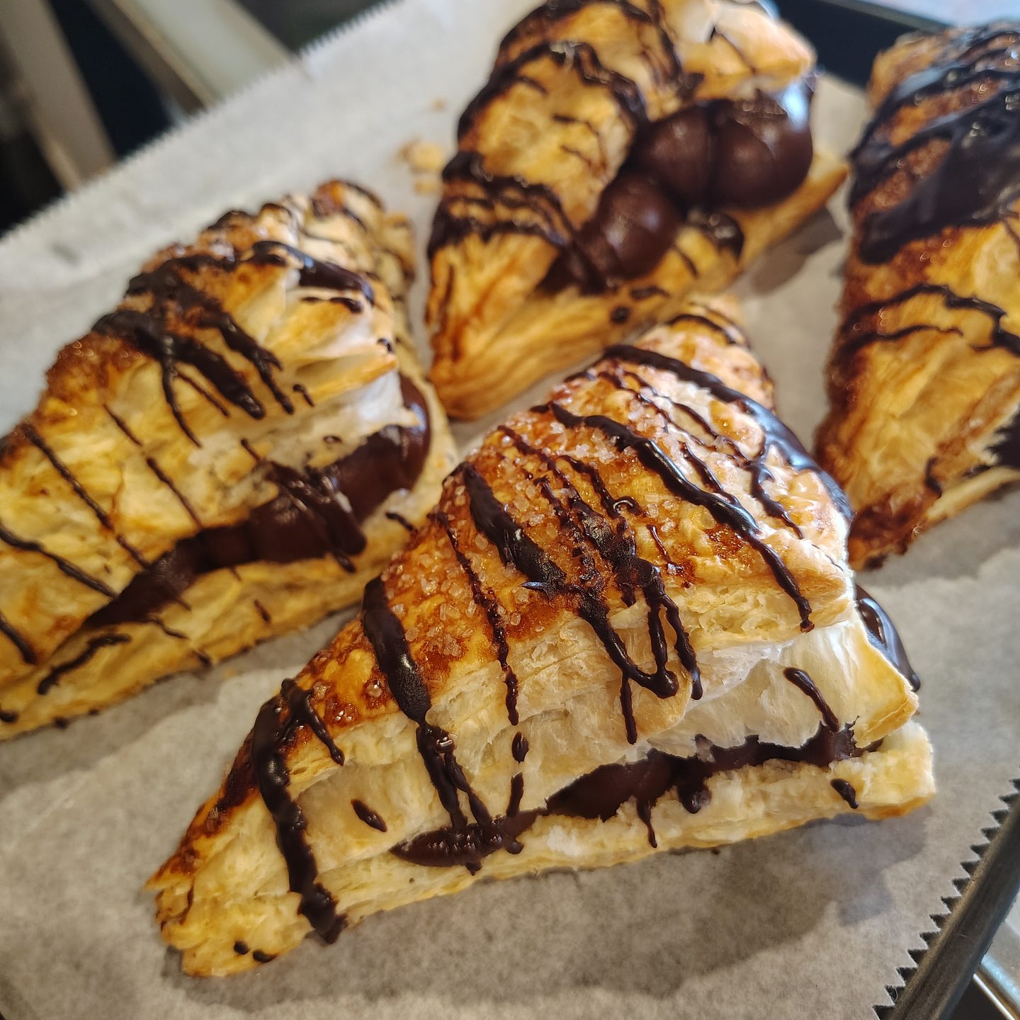 Turnovers finished with a chocolate drizzle